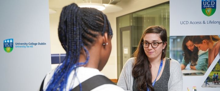 2 persons discussing in the a university building